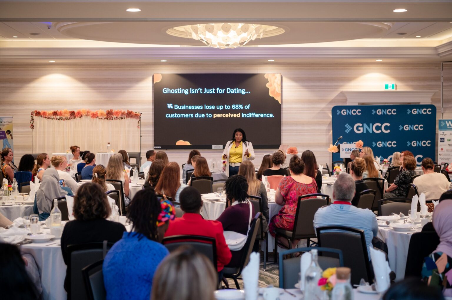 A full room of engaged participants at a live Ignite the Room session led by Crystal D’Cunha